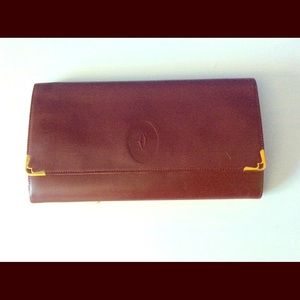 Cartier 100% authentic leather clutch.